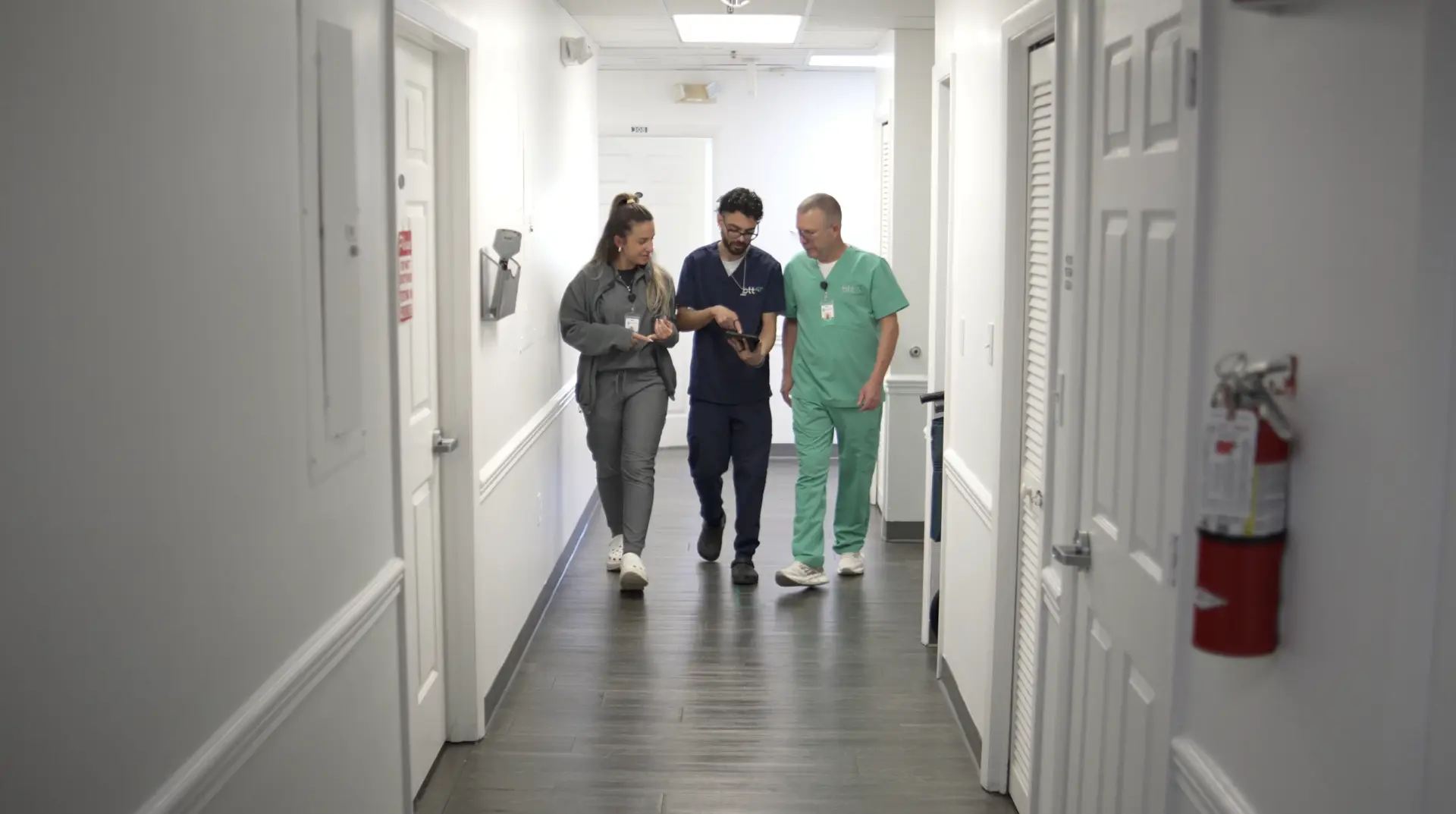 btt clinical team walking through the medical corridor